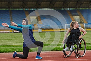 Two strong and inspiring women, one a Muslim wearing a burka and the other in a wheelchair stretching and preparing