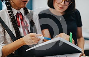 Two students collaborating during a study session at school