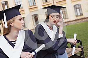 Two students feeling sentimental on their graduation
