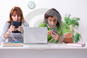 Two students in gadget dependency concept