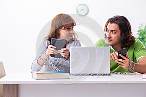 Two students in gadget dependency concept