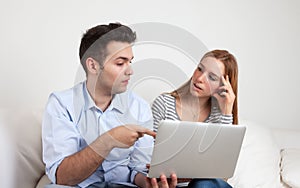 Two students learning with a notebook