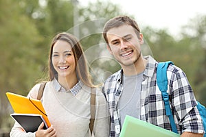Two students looking at camera