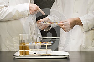 Two students performing an experiment