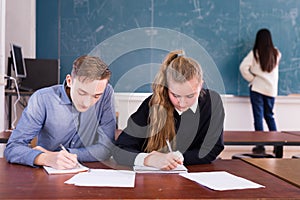 Two students studying in classroom