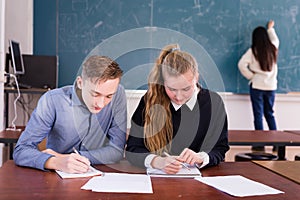 Two students studying in classroom