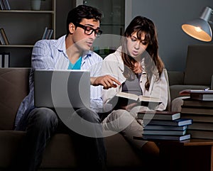 Two students studying late preparing for exams