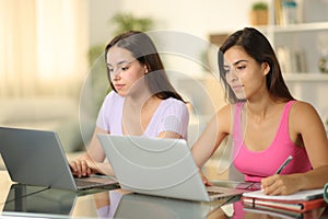 Two students studying together at home