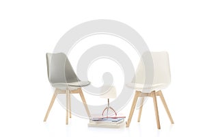 Two stylish modern chairs facing each other