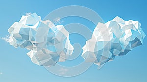 Two stylized 3d clouds with a polygonal design floating against a clear blue sky - might be a symbol for cloud computing