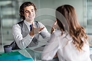 Two successful business partners working at meeting in office