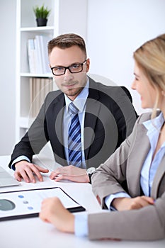 Two successful business partners working at meeting in office