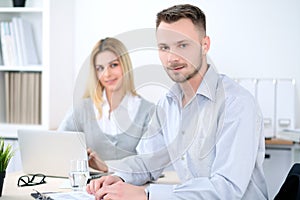 Two successful business partners working at meeting in office