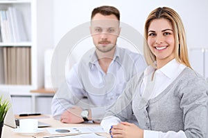 Two successful business partners working at meeting in office