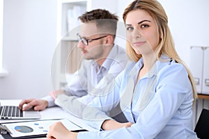 Two successful business partners working at meeting in office