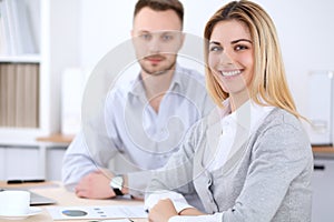 Two successful business partners working at meeting in office