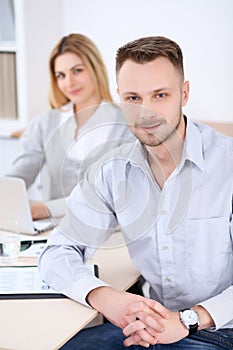 Two successful business partners working at meeting in office. Focus on man