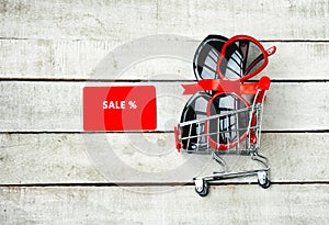 Two sunglasses in supermarket trolley, concept of promotions