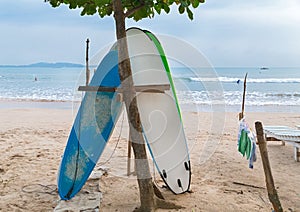 Two surf boards on sandy Weligama beach in Sri Lanka