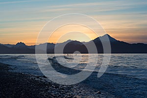 Two surfers on Kachemak Bay Alaska