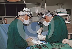 Two surgeons operating