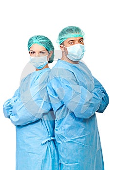 Two surgeons in sterile uniforms photo