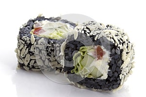Two sushi with black rice closeup.Sushi rolls with rice and fish on a white plate with reflec