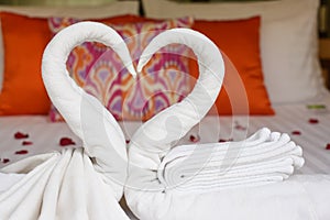 Two swans and heart made from towels