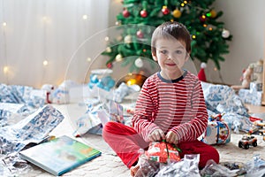 Two sweet boys, opening presents on Christmas day