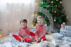 Two sweet boys, opening presents on Christmas day