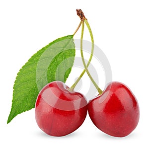 Two sweet cherries with leaf isolated on white