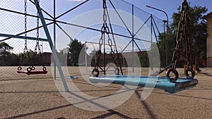 Two swings for children in the summer