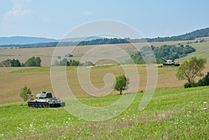 Two T34 tanks standing on fields in Valley of Death in Northern Slovakia