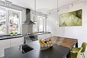 Two tables in bright kitchen