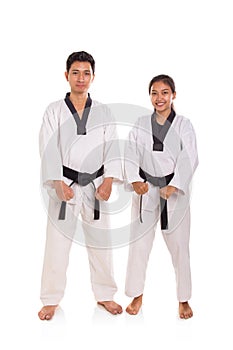 Two taekwondo athletes standing over white background