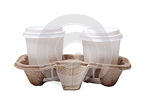 Two take-out coffee in holder. Isolated on a white. Two take out coffee cups in pressed cardboard cup holder isolated