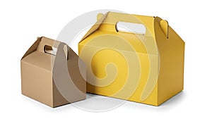 Two takeout boxes, one brown, one yellow