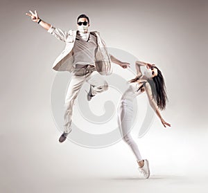 Two talented dancers wearing hygienic masks