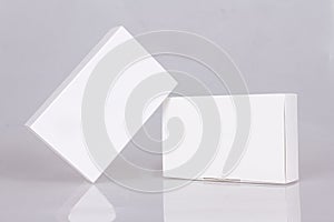 Two tall white boxes. Mockup ready for your design. Box perspective. Box template. Box empty blank.