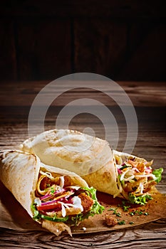 Two tasty doner kebabs with rustic copy space