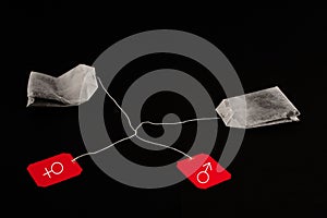 Two tea-bags isolated on a black background