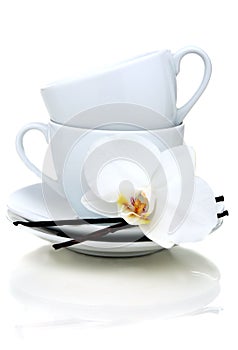 Two teacups, vanilla and flower.