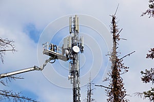 Two Technicians Working On A Telecommunication Tower