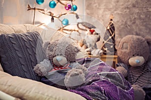 Two teddy bear sitting and waiting for a Christmas.