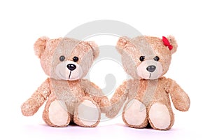 Two teddy bears sitting on white background. Love and relationship concept