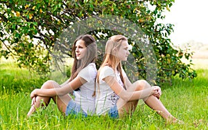 Two teen girls in park