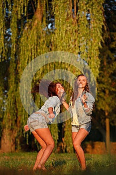 Two teenage girls dancing