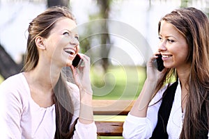 Two teenage girls having fun outdoors