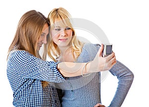 Two teenage girls photographing on camera