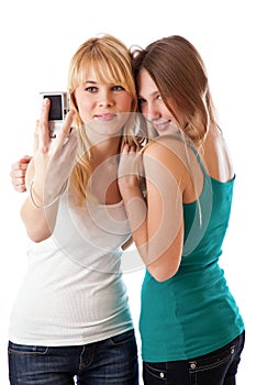 Two teenage girls photographing on camera